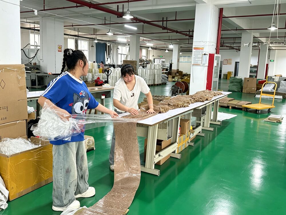 LOCACRYSTAL Pujiang sample measurement bench where operators verify finished rhinestone trim against the master spec