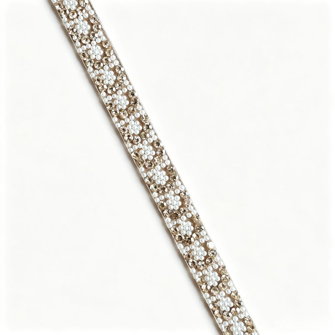 Pearls set into a paved rhinestone band on a bangle